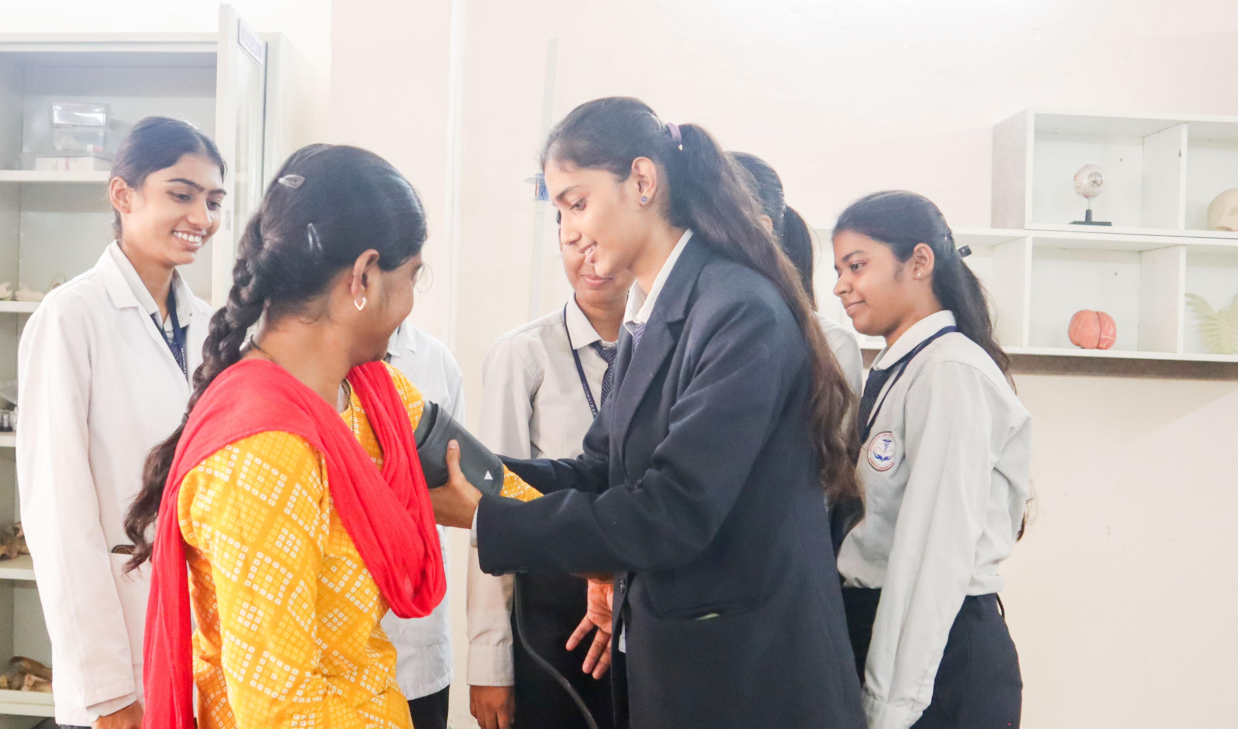 Students performing experiments in the pharmacy laboratory at Manwatkar College of Pharmacy
